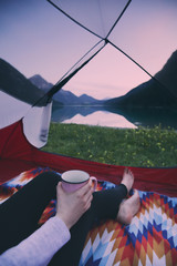 Tent camping on mountain lake