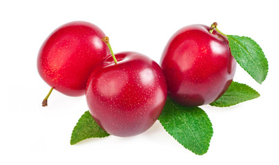red cherry plum, tropical fruit with green leaves isolated on white background