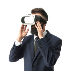 Businessman wearing virtual reality glasses on white background