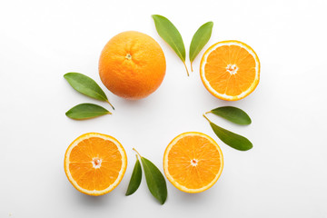 Tasty ripe oranges on white background