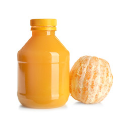 Bottle of juice and fresh orange on white background