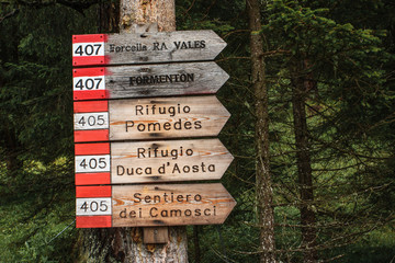 Sign for the lodges on the trail of the Tofane range, Cortina d'Ampezzo, Dolomites, Italy.
