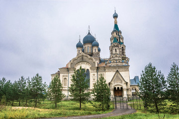 Fototapeta na wymiar Spassky Cathedral in the village of Kukoboy on an overcast day, Russia.