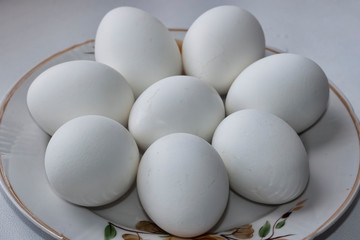 Eight white boiled eggs