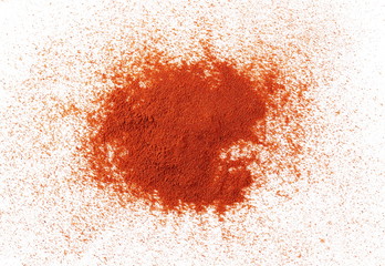Fototapeta na wymiar Pile of red pepper, paprika powder isolated on white background