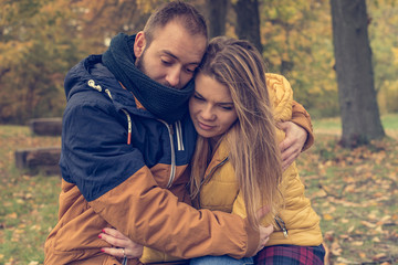 A beautiful girl hugs her boyfriend. Couple in love.