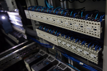 two rows of several contactors in a control cabinet