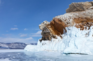  Baikal Lake in winter. Strait Small Sea (Maloe More). Beautiful icy rocks of bizarre shape on the edge of the stone island of Borga- Dagan