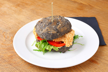 Black burger with grilled chicken 