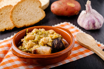 Tagarninas, typical Spanish food with chickpeas, bacon, blood sausage, veal and pork mear.