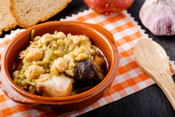 Tagarninas, typical Spanish food with chickpeas, bacon, blood sausage, veal and pork mear.