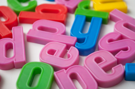 closeup of colorful plastic letters on full frame