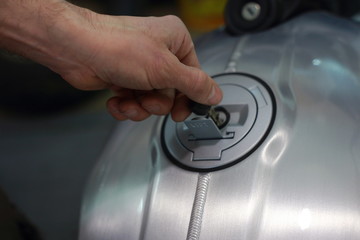 motorcycle key in hand mechanic