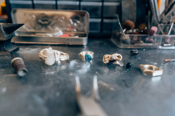 Different jewelery on the table from the jeweler from a close angle