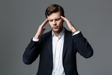 Close up portrait of a tired young businessman