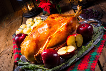 festive stuffed roast goose with red cabbage and dumplings