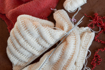 Fototapeta na wymiar Knitting wool and knitting needles, top view, copy space.