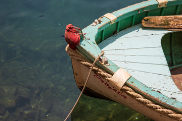 Close up view of the prow of a small rowing boat in Portofino harbour, Italy