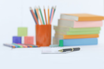 Fototapeta premium pen on blurred background of school supplies .photo with copy space