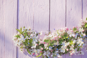 spring flowers on pink wooden background