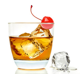 Southern Manhattan Cocktail with ice cubes and maraschino cherry in glass isolated on white...