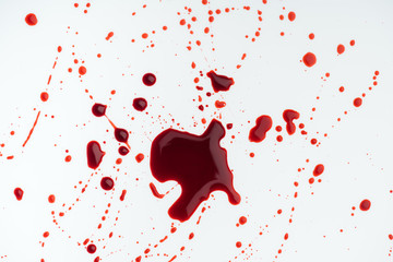 top view of white surface covered with blood droplets