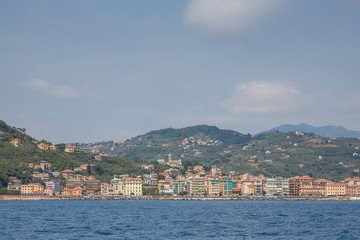 Fototapeta na wymiar Apartments and beach view on the Ligurian coast, captured near Portofino, Italy