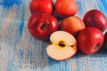 red apples on wooden background