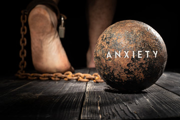 Anxiety is ball on the leg. Concept of fear. - 233368335