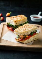 Sandwich with meat, cheese and chilli pepper