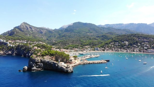 Flight over the bay of Port de Soller in Mallorca Tramuntana Mountains