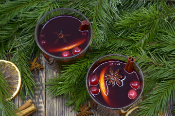 Christmas mulled wine with cranberries in glasses winter warming drink with spices decorated with...