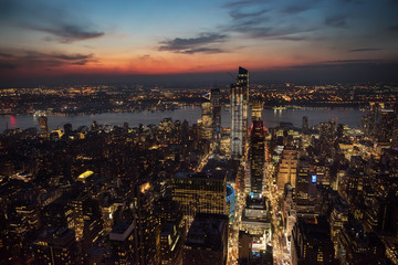 View of the night city and glowing skyscrapers from a height at sunset  New York. USA

