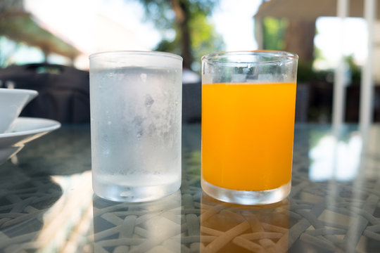 Glass of water and orange juice