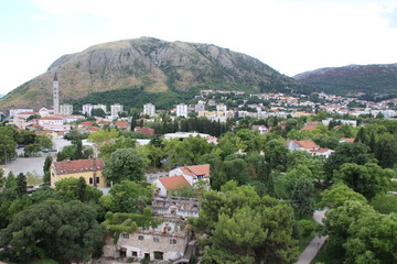 The historic town of Mostar, spanning a deep valley of the Neretva River, developed in the 15th and 16th centuries as an Ottoman frontier town and during the Austro-Hungarian period in the 19th