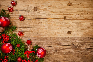 Christmas fir tree on wooden board background with copy space