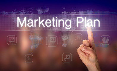 A hand selecting a Marketing Plan business concept on a clear screen with a colorful blurred background.