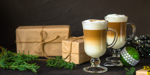Latte - coffee with milk in a transparent cup on the table. Top view.