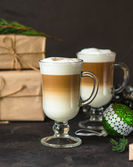 Latte - coffee with milk in a transparent cup on the table. Top view.