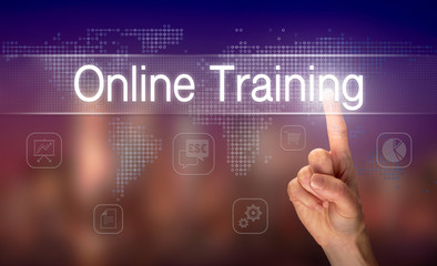 A hand selecting a Online Training business concept on a clear screen with a colorful blurred background.