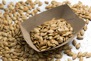 Homemade roasted spicy pumpkin seeds with cumin and brown sugar