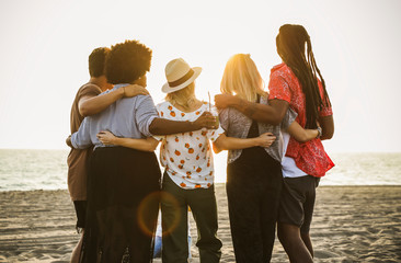 Friends watching the sunset at the beach