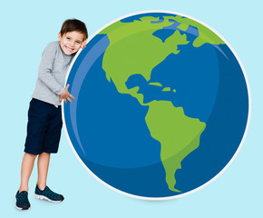 Young boy hugging planet earth