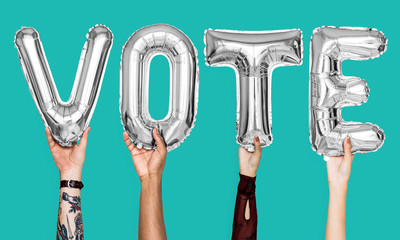 Silver gray alphabet balloons forming the word vote