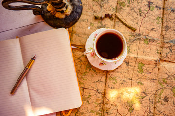 A cup of coffee on a map