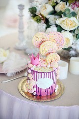 pink cake for little Princess with crown and yellow marshmallows.
