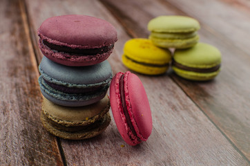 French macaroon cake. Macaroons in box with dried flowers on wood background
