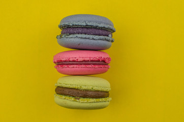 French macaroon cake. Macaroons in box with dried flowers on wood background