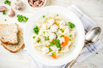 Healthy food, diet lunch. Soup with meatballs, fresh vegetables and greens.
