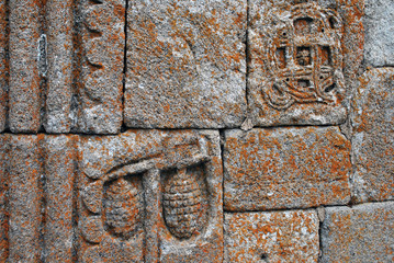 The ancient decorative carving on the wall of the Gergeti Trinity Church in Georgia